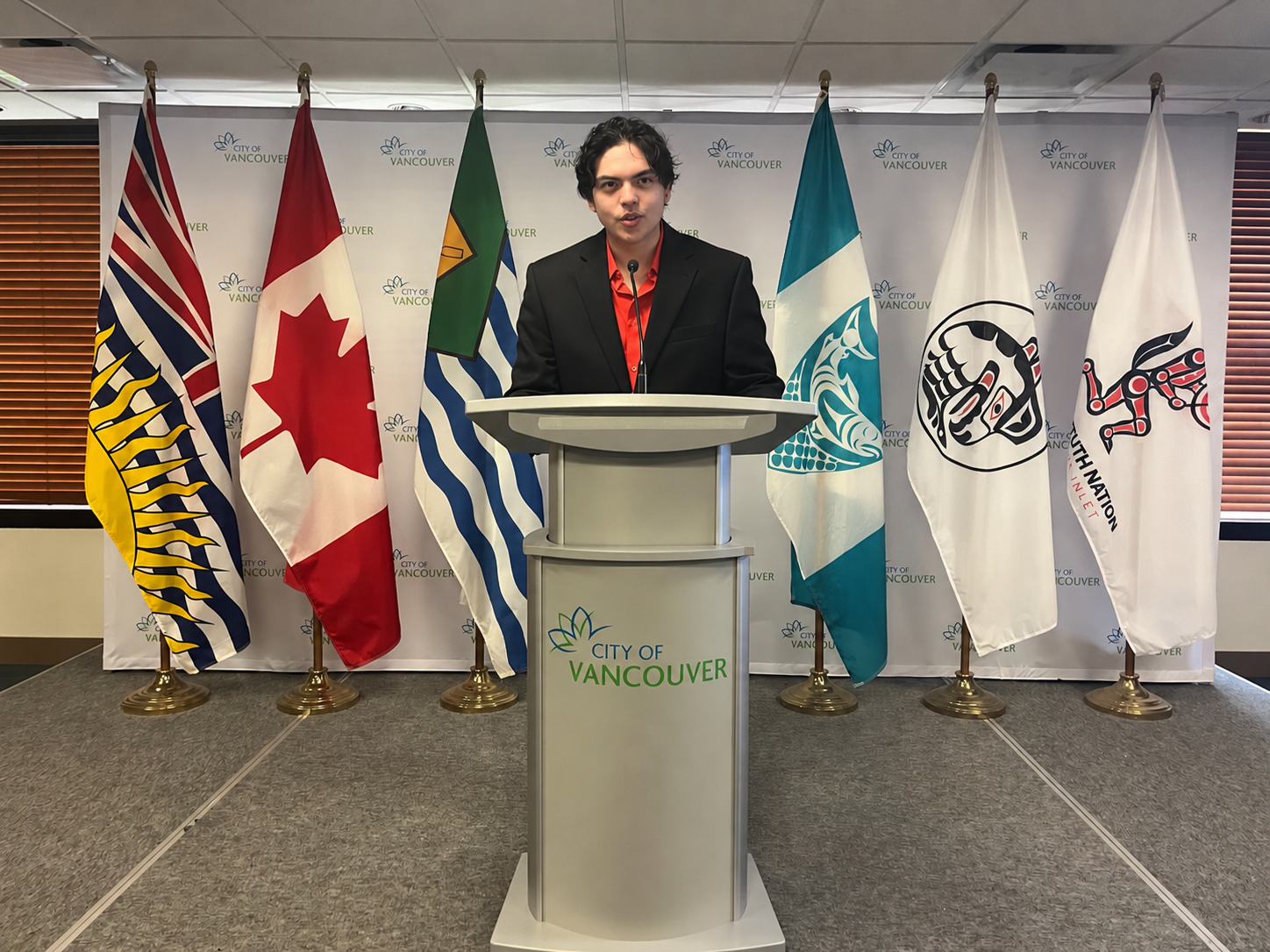 Johan Michael Bóndoc speaking at a podium